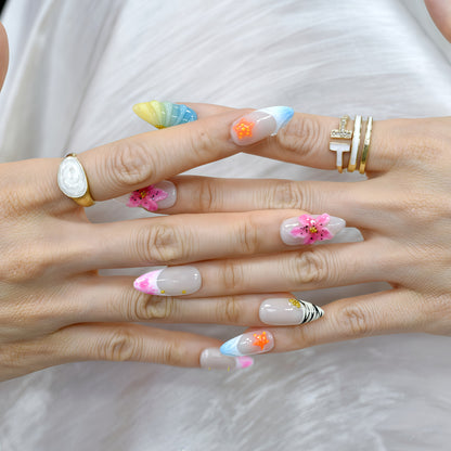 Medium almond tropical-themed press-on nails with zebra stripes, ombre seashell textures, 3D hibiscus flowers, and starfish accents.