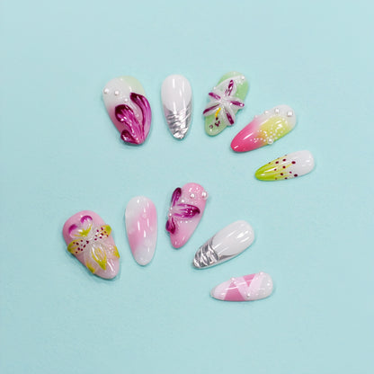 Tutti Frutti Bloom press-on nails featuring a colorful mix of pink, green, and purple with 3D flowers, jelly gradients, and pearl accents in almond shape.