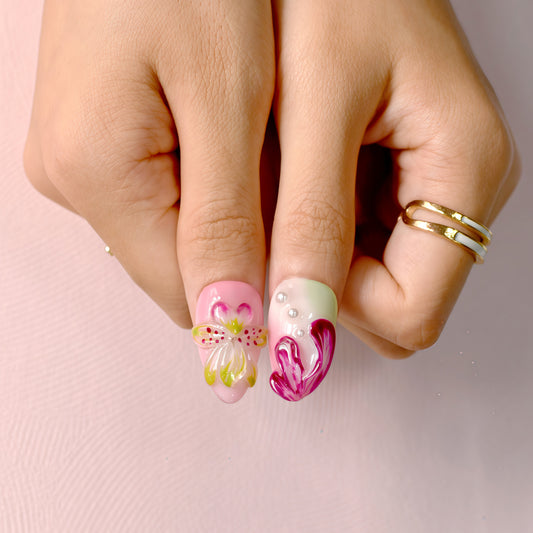 Tutti Frutti Bloom press-on nails featuring a colorful mix of pink, green, and purple with 3D flowers, jelly gradients, and pearl accents in almond shape.