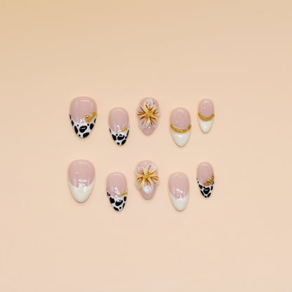 Handmade press-on nails with black animal print, orange floral design, and nude French tips – Wild Bloom Elegance set.