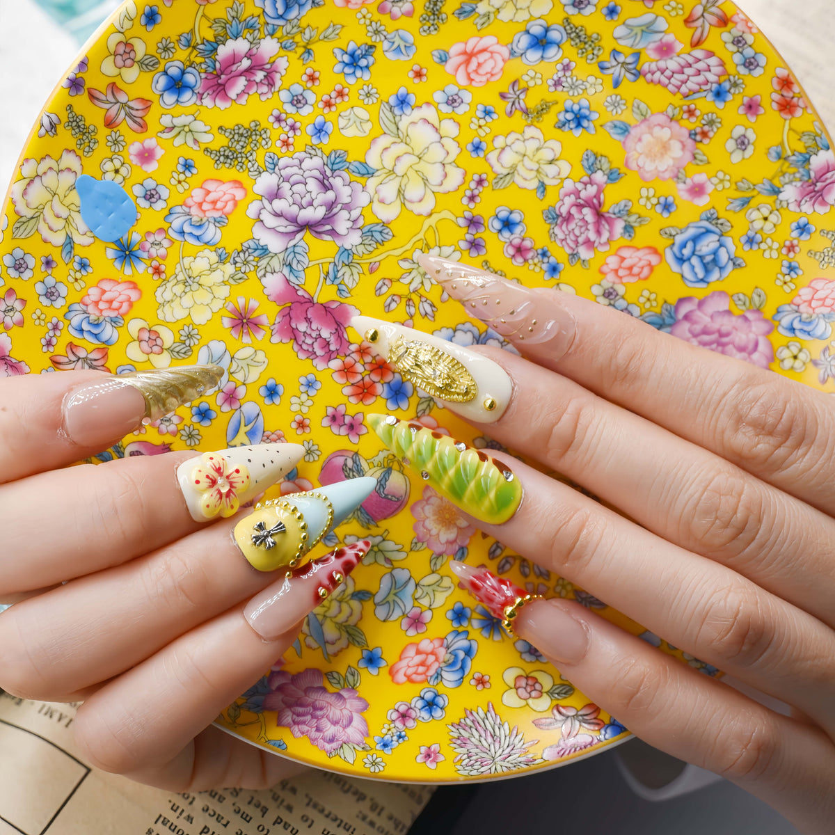 Colorful handmade fruit inspired press on nails featuring citrus slices, blueberry details and dessert inspired artwork.