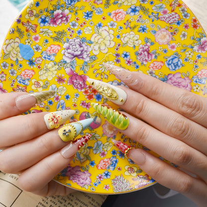 Colorful handmade fruit inspired press on nails featuring citrus slices, blueberry details and dessert inspired artwork.