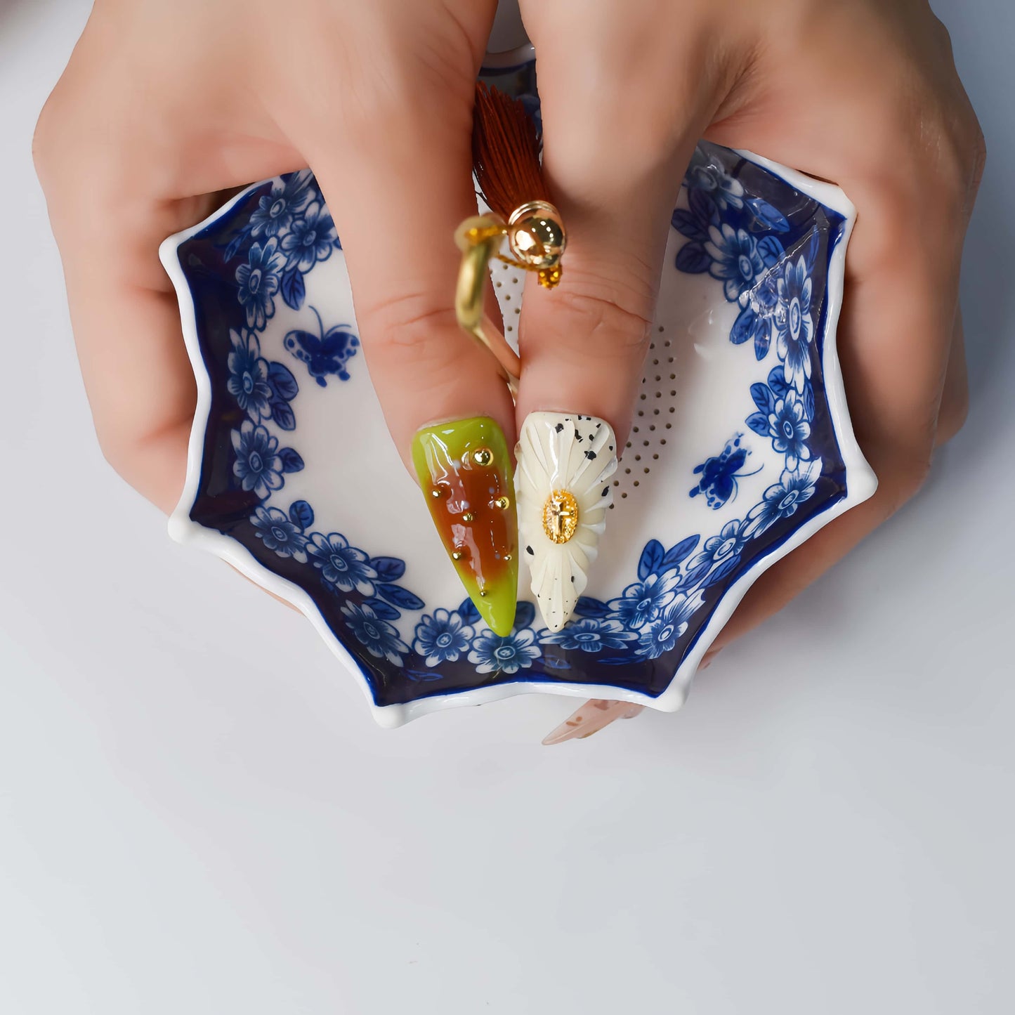 Colorful handmade fruit inspired press on nails featuring citrus slices, blueberry details and dessert inspired artwork.
