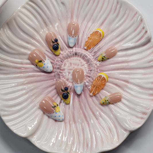 Summer fruit themed press on nails featuring lemons, blueberries and gingham nail art.