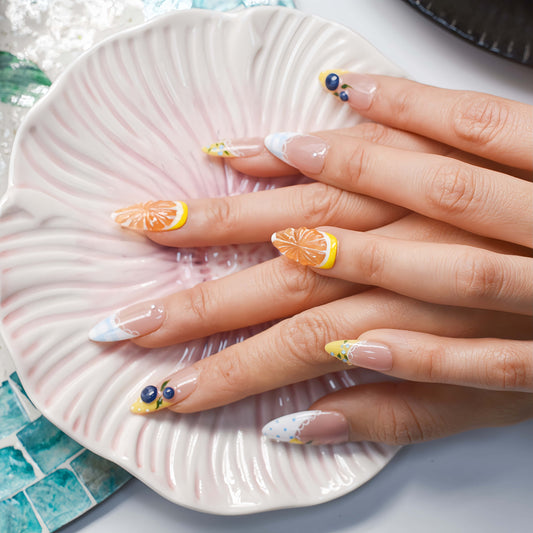Summer fruit themed press on nails featuring lemons, blueberries and gingham nail art.