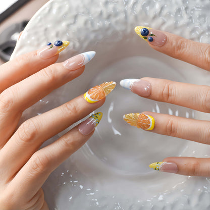Summer fruit themed press on nails featuring lemons, blueberries and gingham nail art.