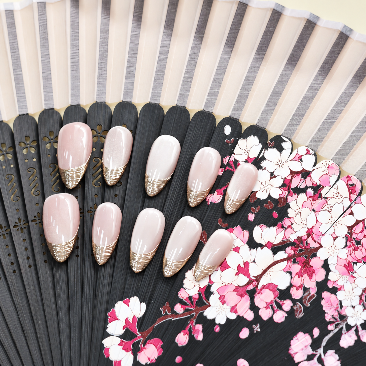 Silver Silk French sheer nude press-on nails with finely layered metallic silver tips — styled product photograph.