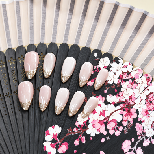 Silver Silk French sheer nude press-on nails with finely layered metallic silver tips — styled product photograph.