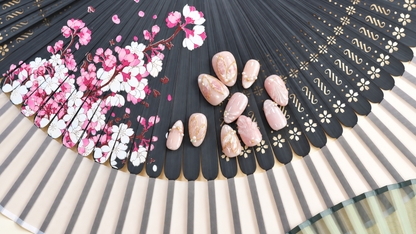 Rose Gold Leaf Veil peach press-on nails with translucent leaves, pearls and fine gold outlines — styled product photograph.