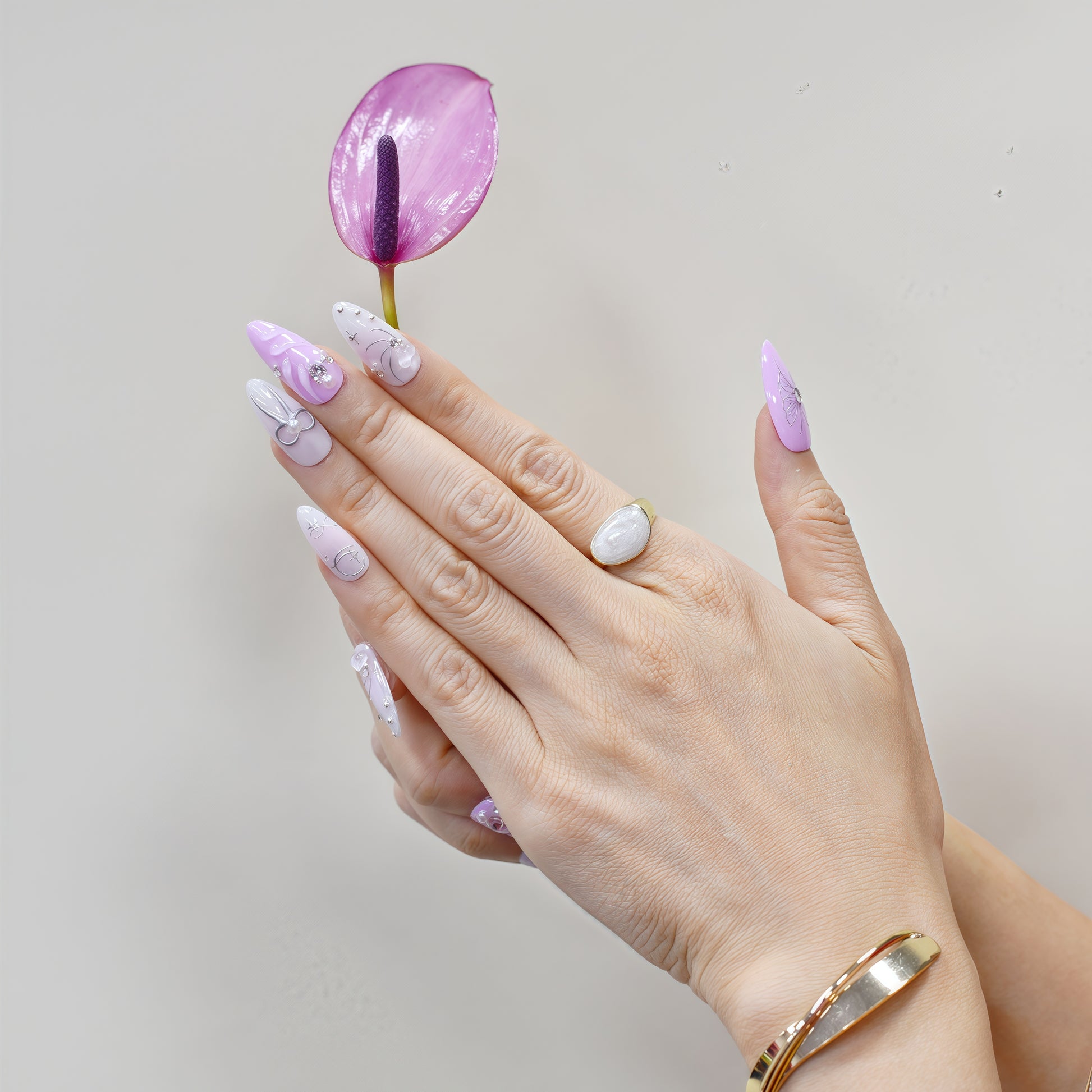 Pink and silver butterfly & bow press-on nails with rhinestone details – handcrafted romantic nail art.